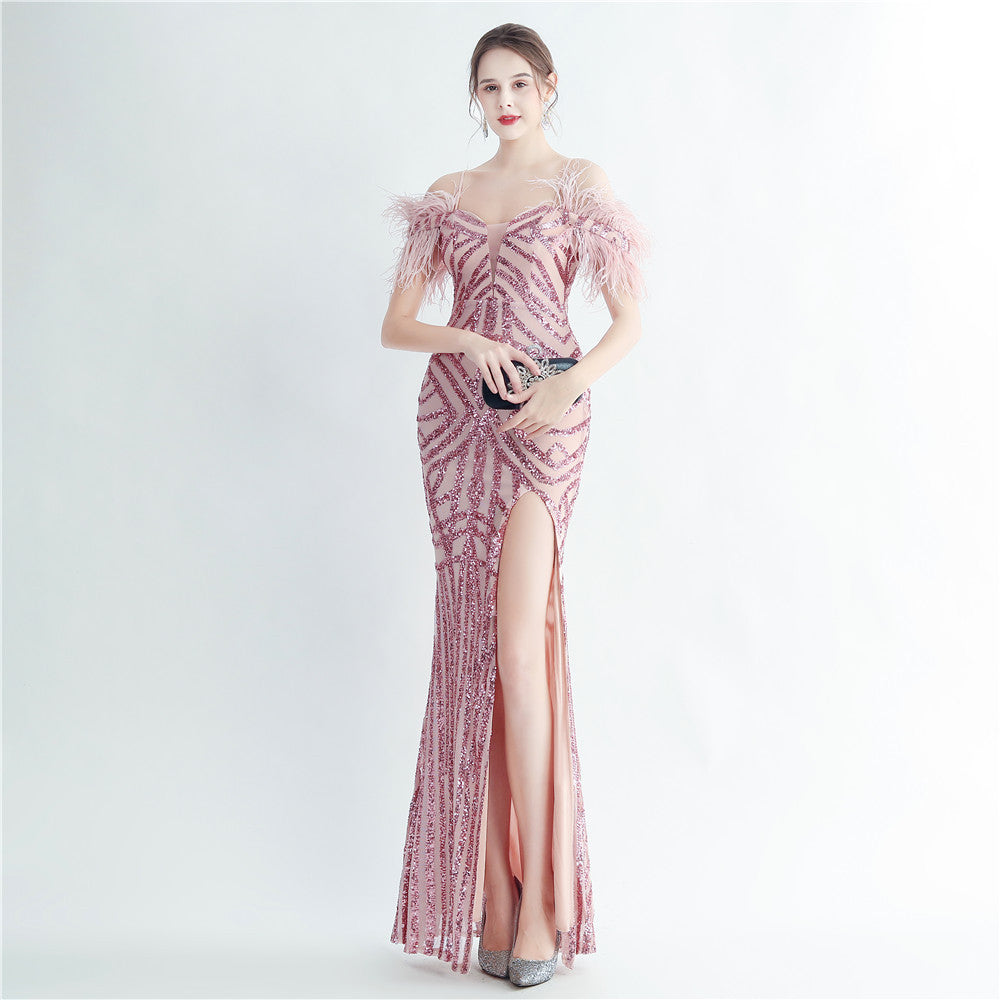 Positioning sequin feather straps off shoulder formal party evening dress