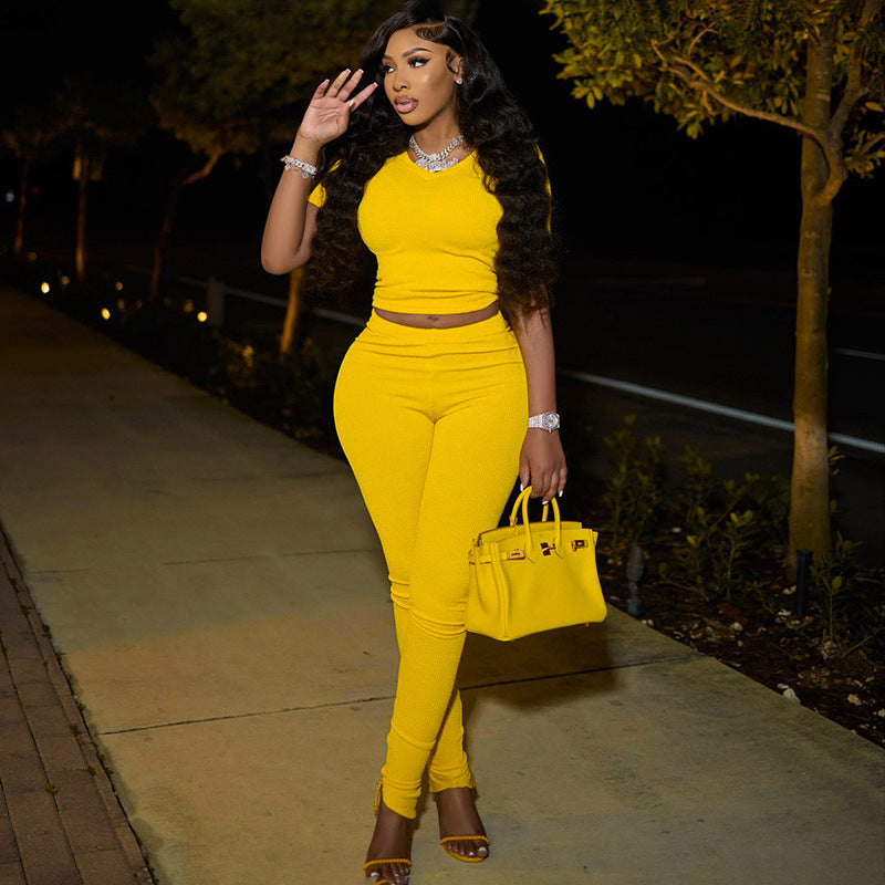 Solid color ribbed V neck short sleeve top tight fitting bell bottom split trousers casual two-piece set