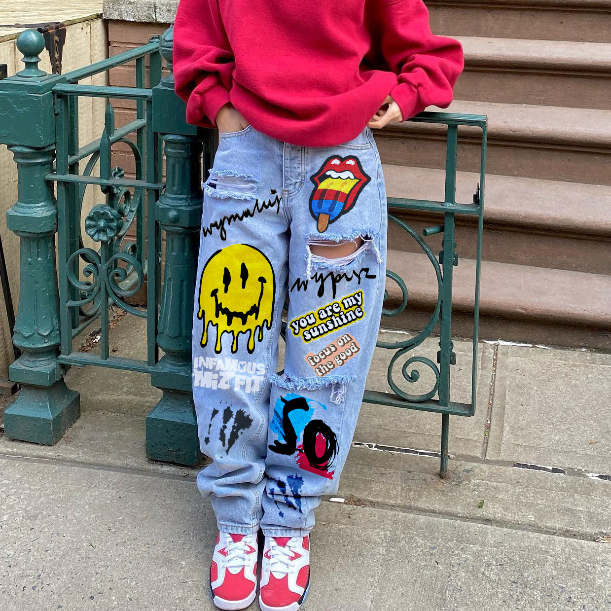 Women printed ripped denim pants