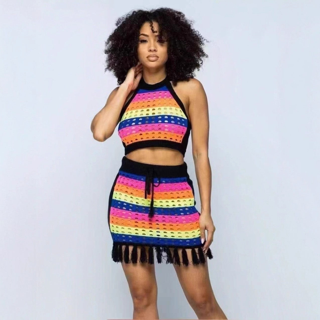 Women multi-color striped hollowed-out knitting halter neck top with tassel bodycon skirt, two-piece set.